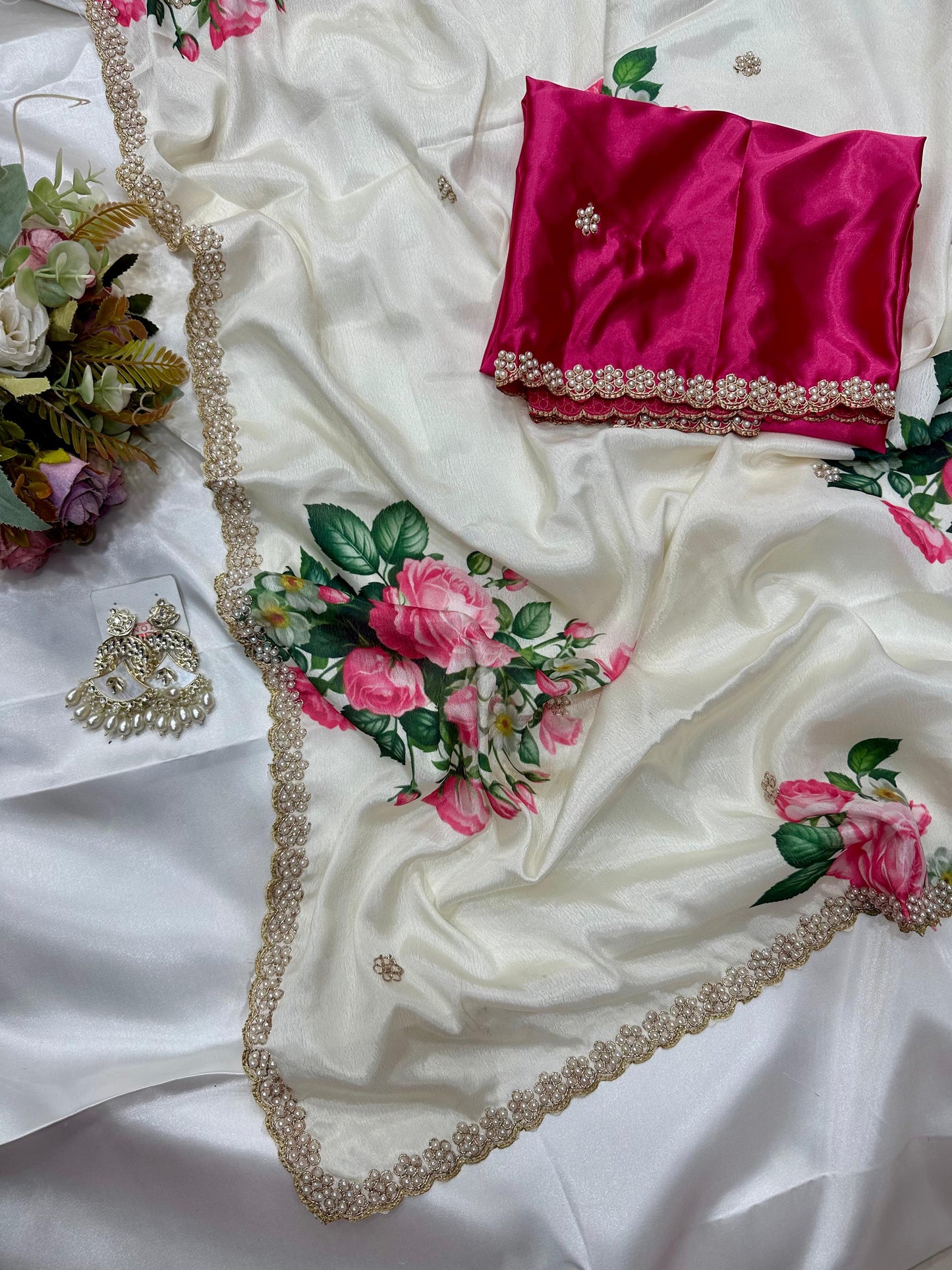 White floral embroidered chinon saree with a pink blouse piece