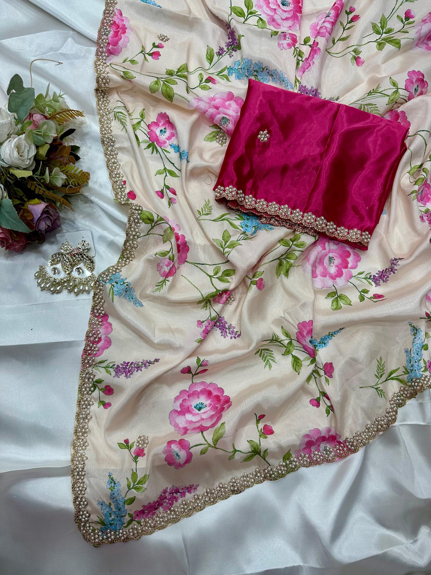 Off white floral embroidered chinon saree with a pink blouse piece