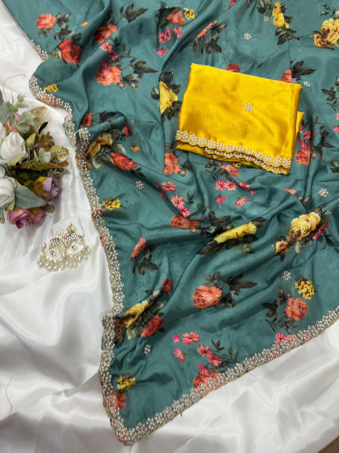 Teal green floral embroidered chinon saree with a yellow blouse piece