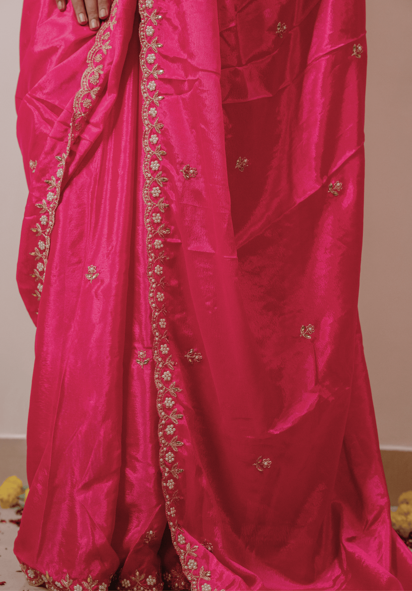 Pink chinon saree with intricate gold and white embroidery 