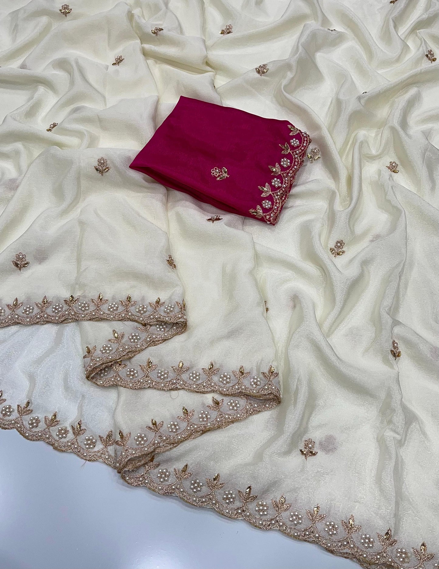 Ivory chinon saree with gold embroidery and a pink blouse piece 