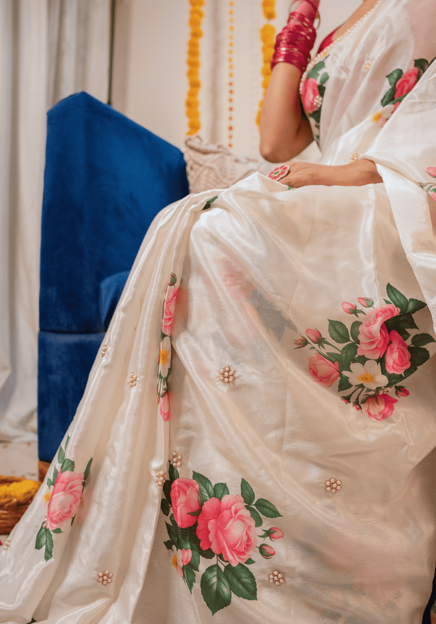 Close up of ivory chinon floral saree with  embroidery.