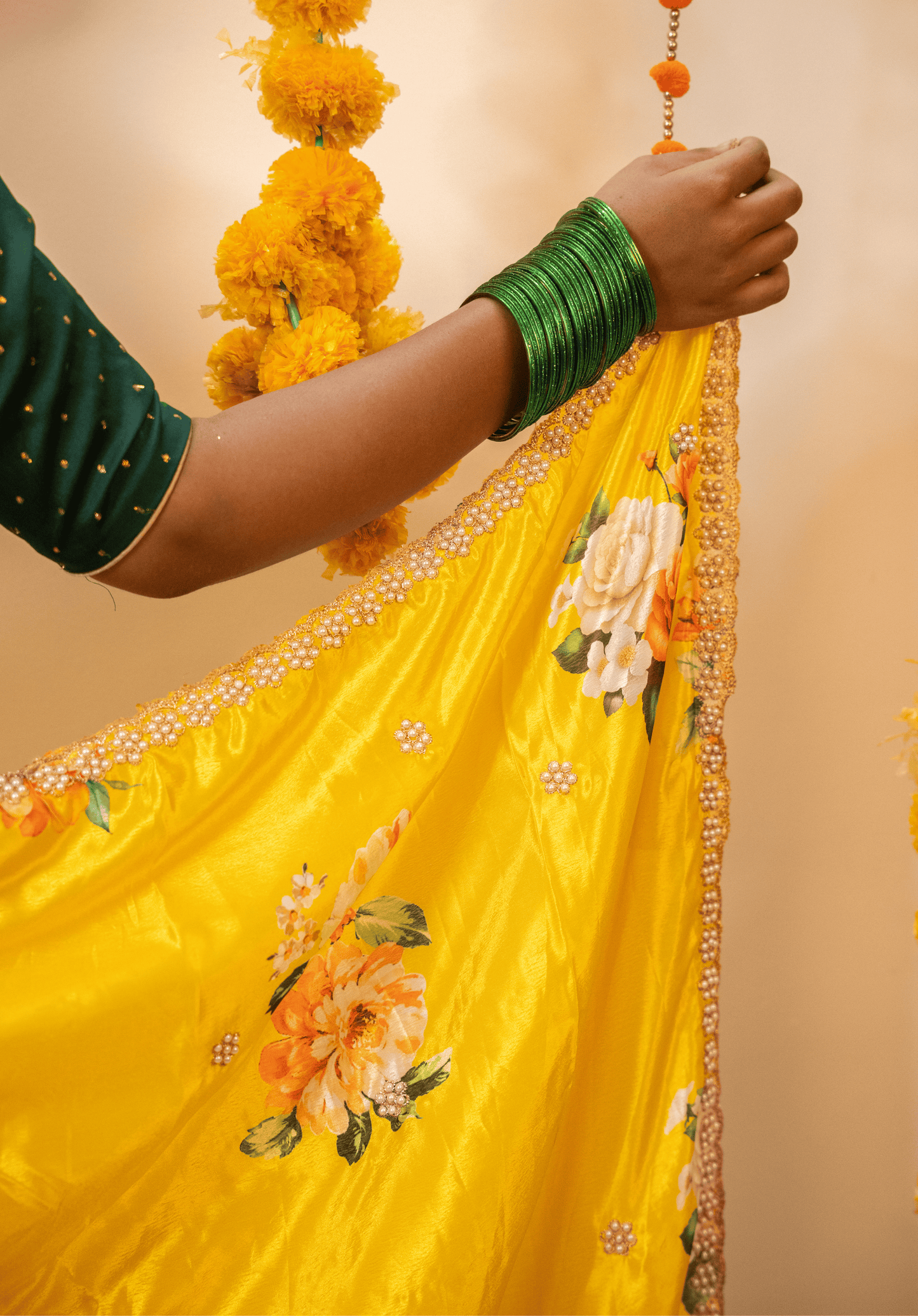 Lemon yellow floral chinon saree pallu with white and gold embroidered border.