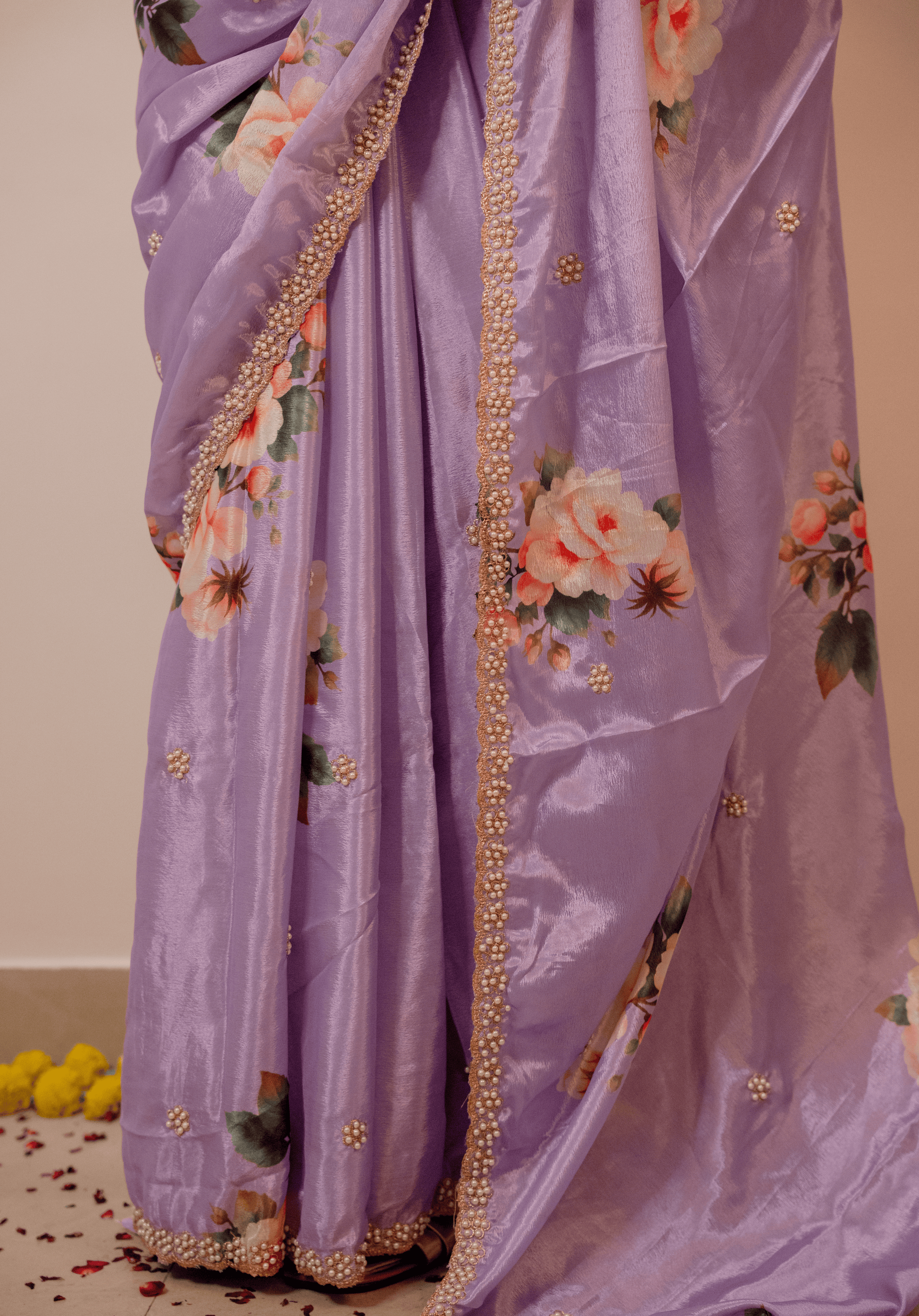 Lilac chinon saree with floral patterns and gold border