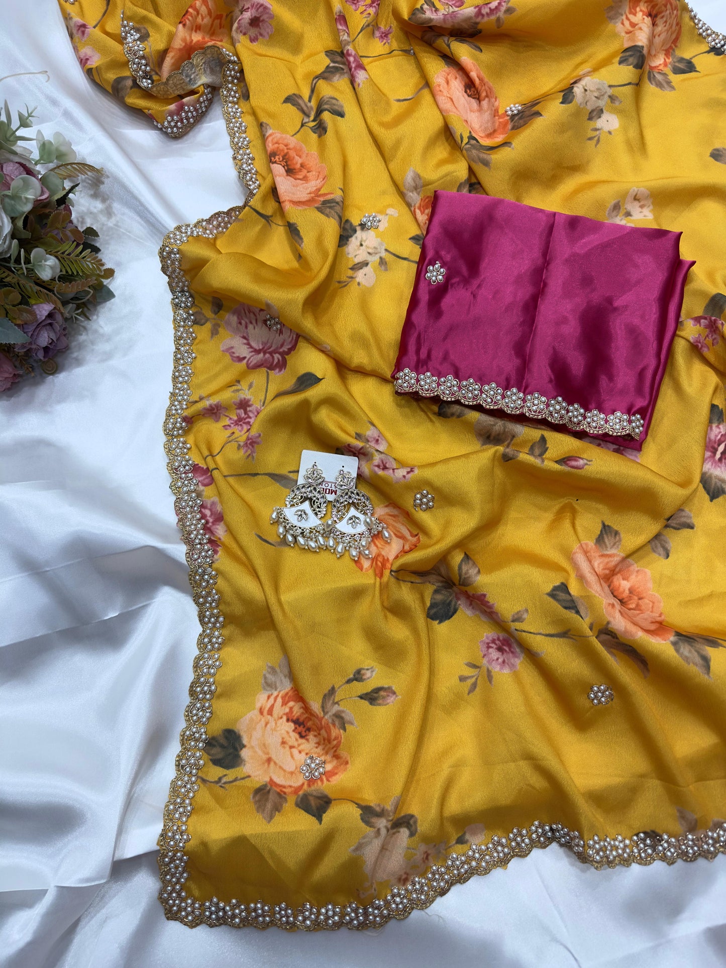 Yellow floral embroidered chinon saree with a pink blouse piece