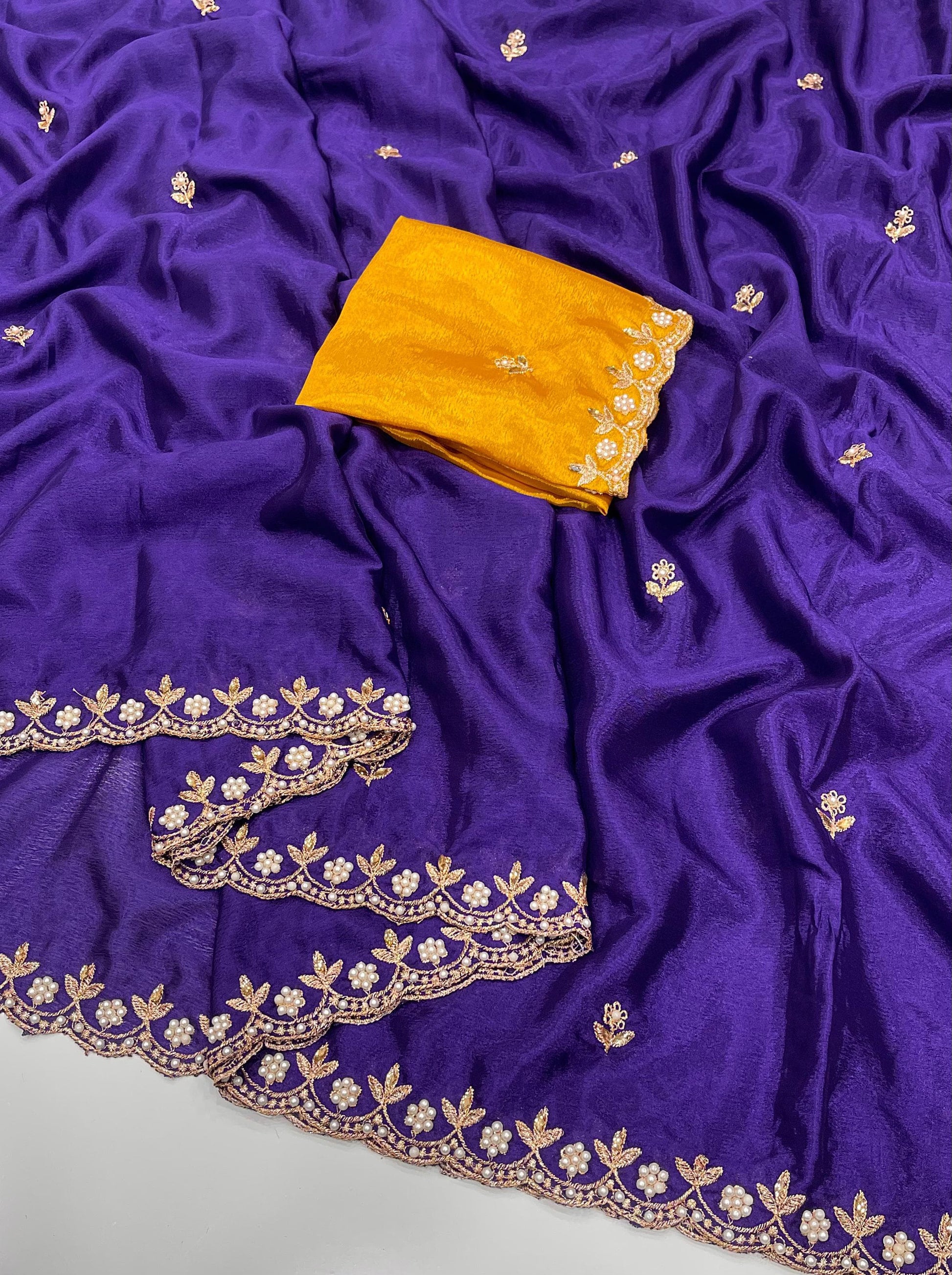 Purple chinon saree with gold embroidery and a yellow blouse piece 