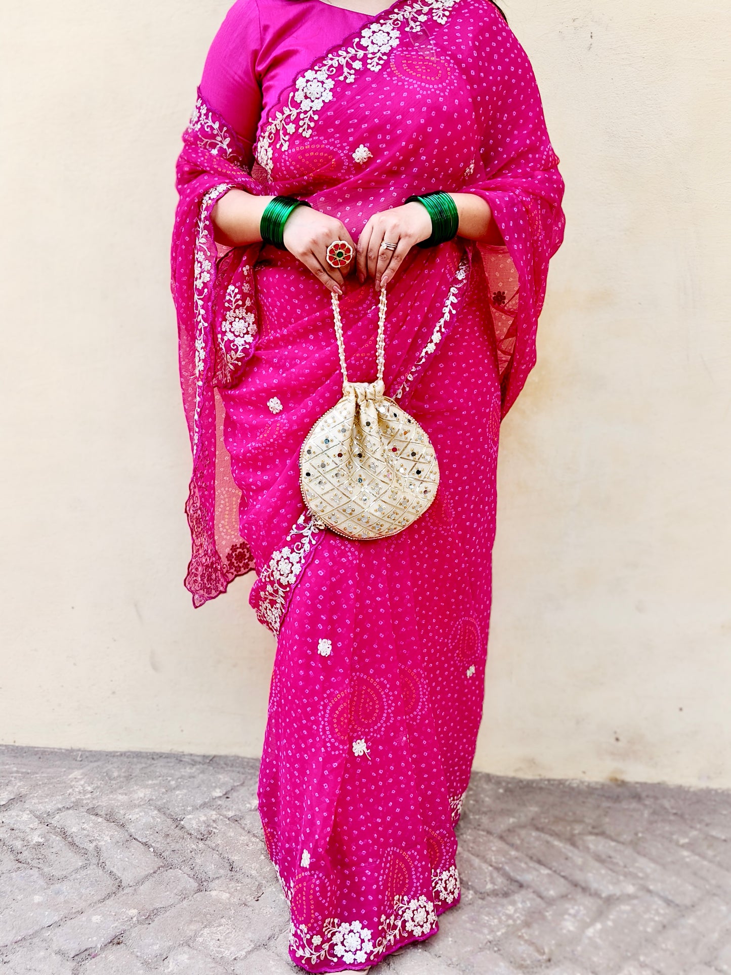 Close up of gota patti border in pink pure chiffon bandhani saree.